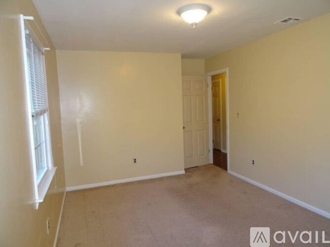 A room with a door and a window.