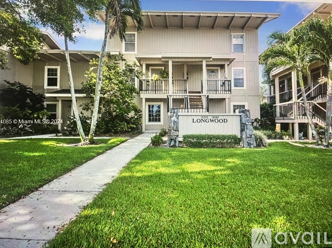 A residential building with the name "LONGWOOD" on the front.