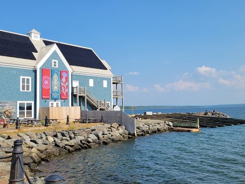 A blue building with a red banner on it.