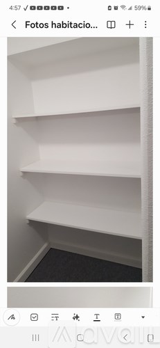 A white shelf with no items on it.