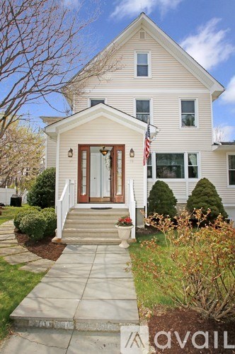 A house with a flag on the front porch.