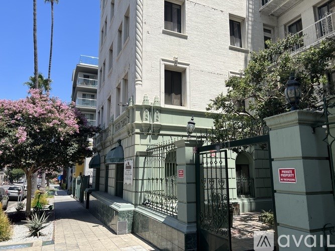 A street view of a building with a sign that says "NO PARKING ANYTIME".