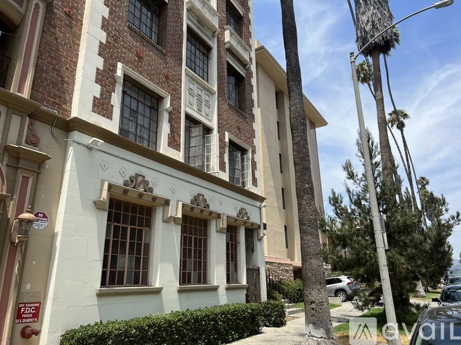 A building with a brick facade and a sign that reads "FDIC" on the left side.