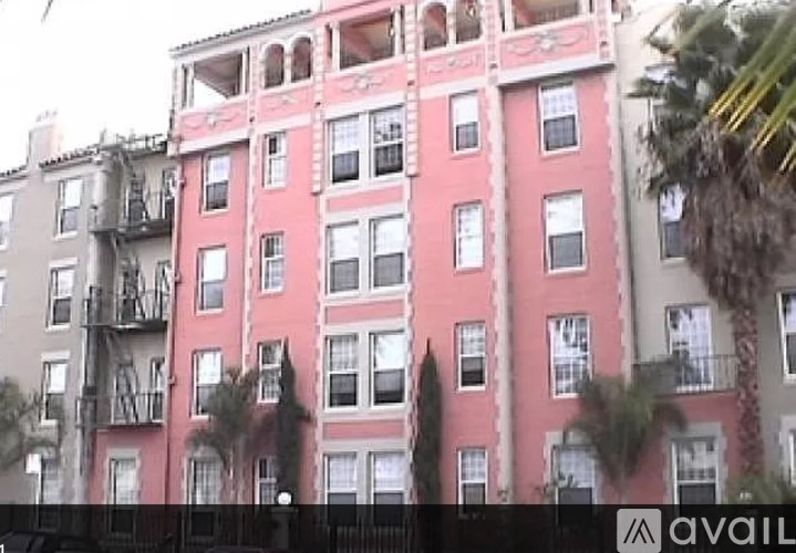 A tall building with balconies and windows.
