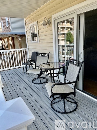 A patio with a table and chairs.
