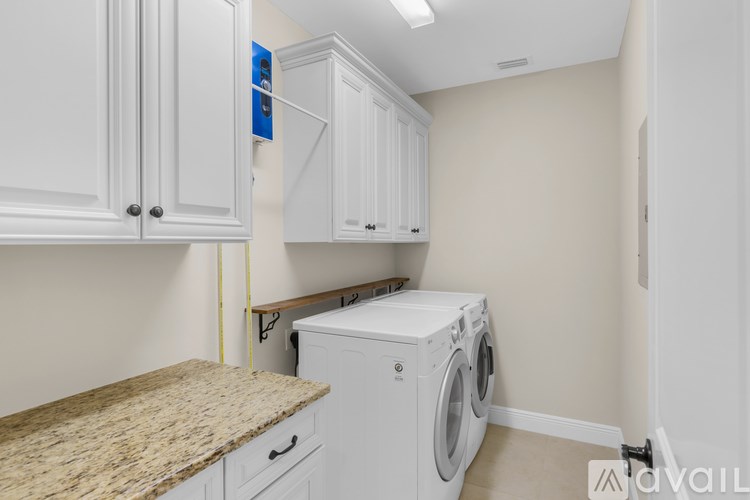 A laundry room with a washer and dryer.