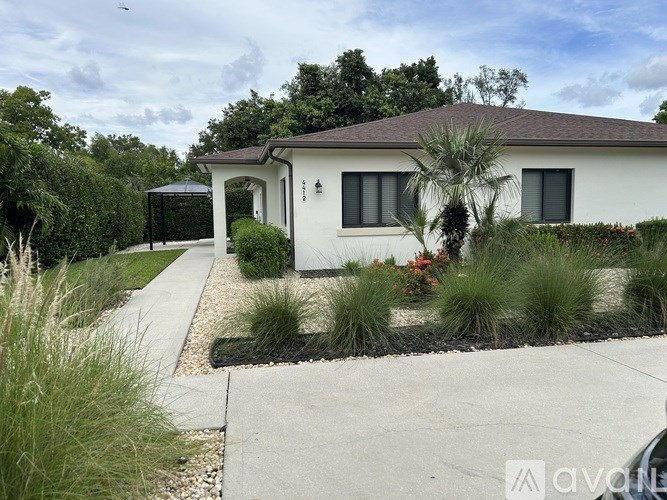 A chandelier with five lights hanging from the ceiling.