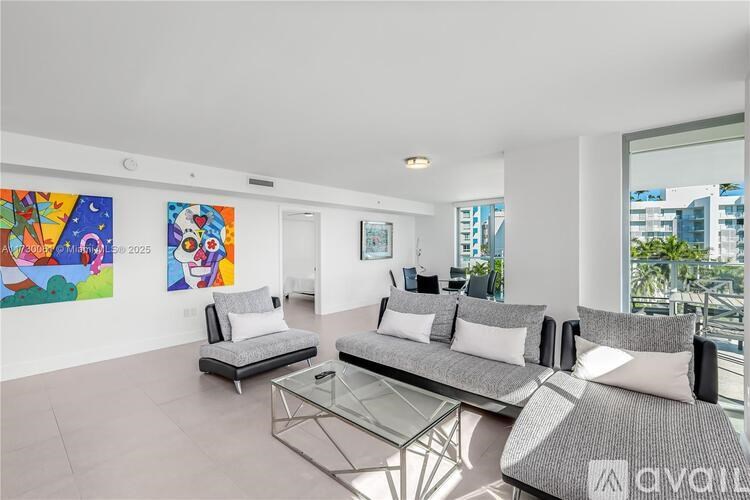 A living room with a couch, a chair, and a coffee table.