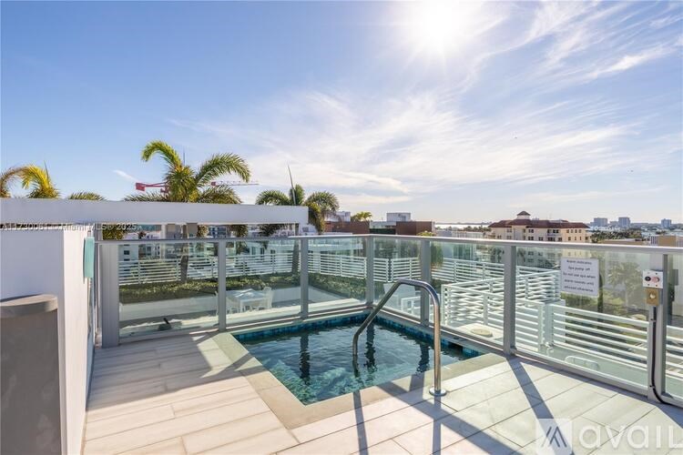 A sunny day at the pool with a view of the city.