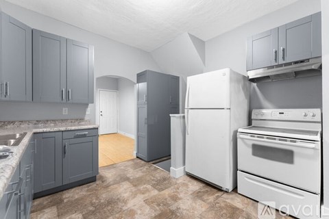 A kitchen with a white refrigerator and a white oven.