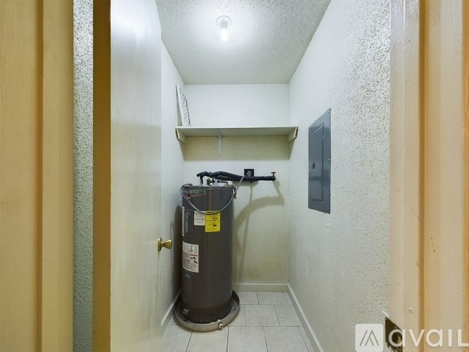 A water heater is installed in a small room.