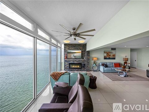A living room with a fireplace and a couch.