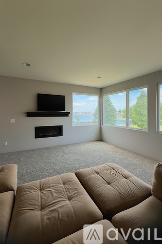 A living room with a fireplace and a television mounted above it.