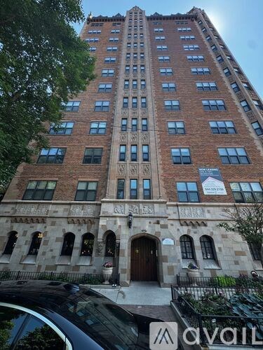 A tall building with a sign that says "avail" on it.