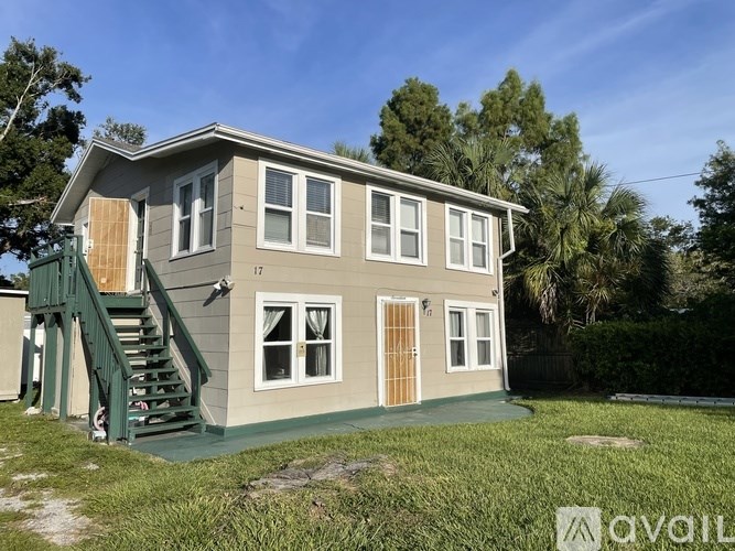 A house with the number 17 on it is for sale.