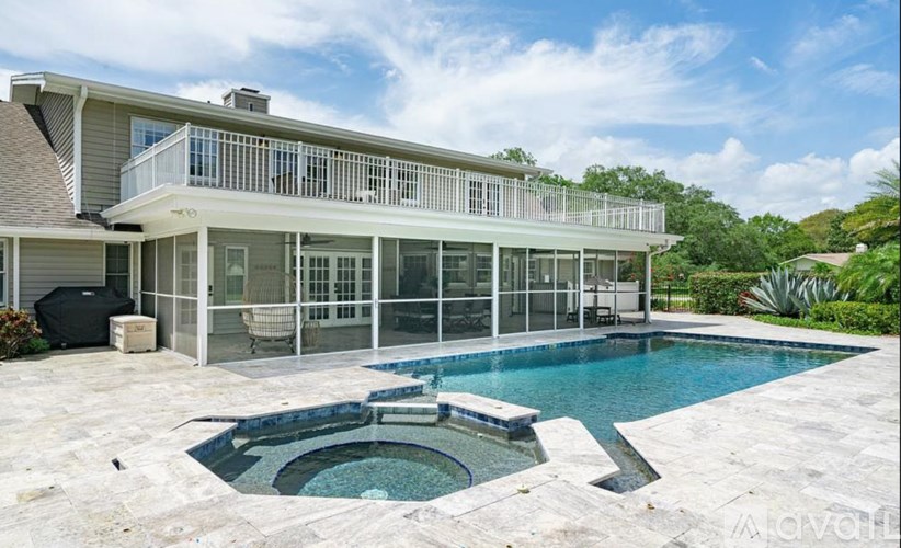A modern house with a pool in the backyard.