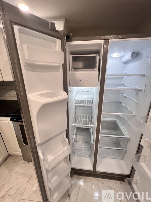 A bathroom with a white vanity and a toilet.
