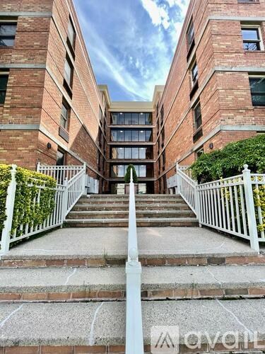 A set of stairs leads to a building entrance.