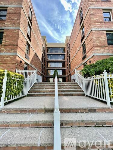 A set of stairs leads to a building entrance.