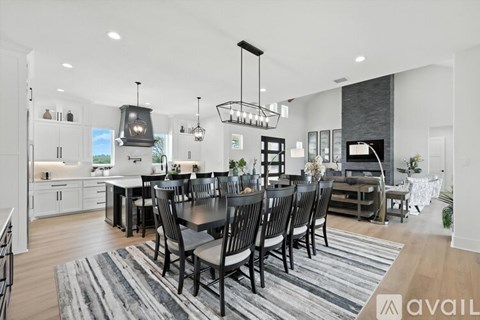 A modern kitchen with a dining table set for six.
