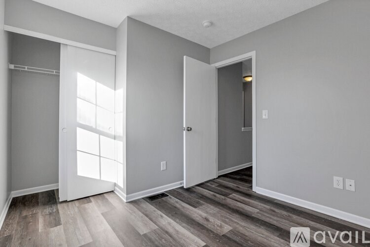 A room with a door and a window.