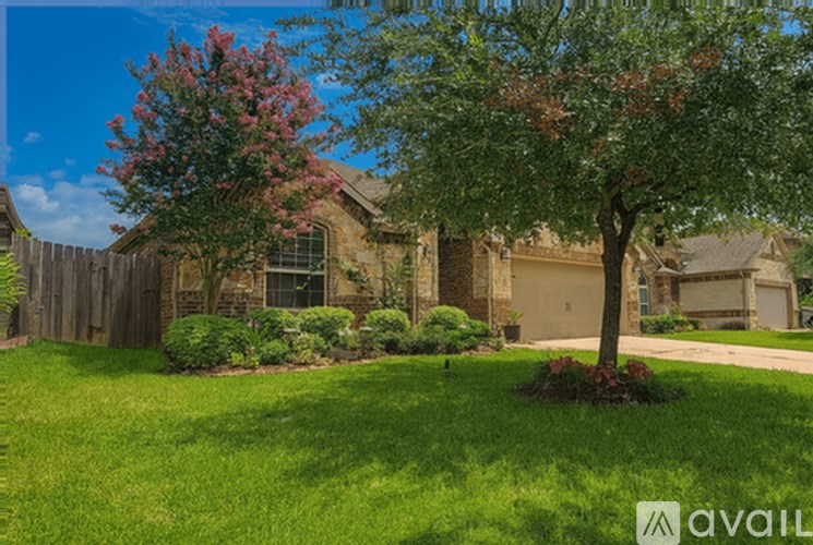 A house with a tree in front of it.