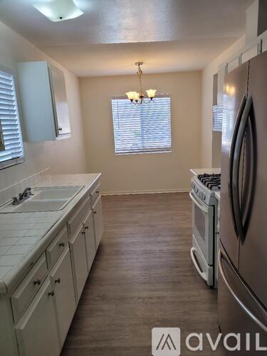 A kitchen with a washer and dryer built in.