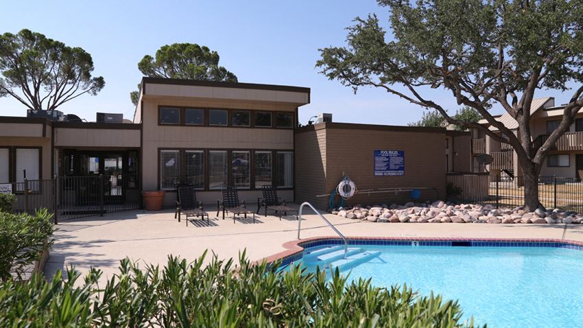 a swimming pool in front of a building