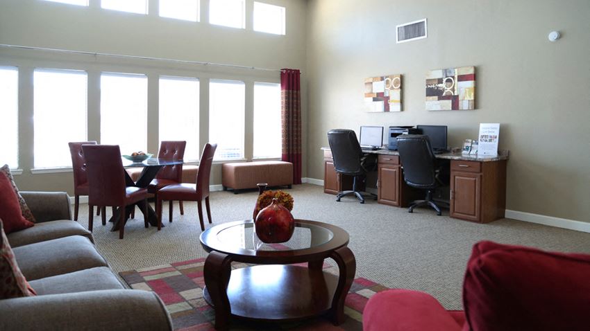 a living room with couches and a table with an apple