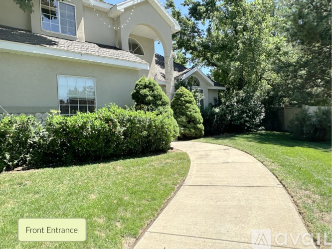 A house with a front entrance and a pathway leading to it.