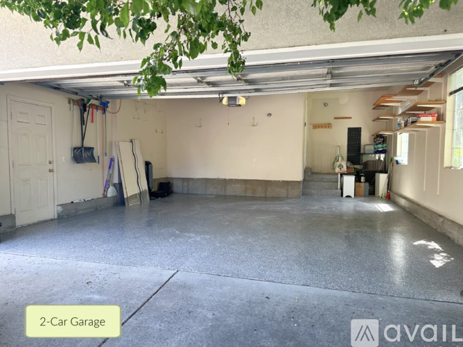 A 2-car garage with a concrete floor and white walls.