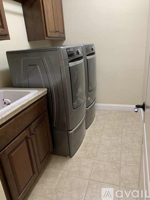 A laundry room with a washer and dryer.