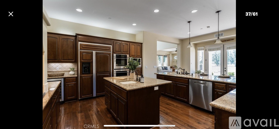 A kitchen with wooden cabinets and a central island.