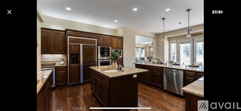 A kitchen with wooden cabinets and a central island.