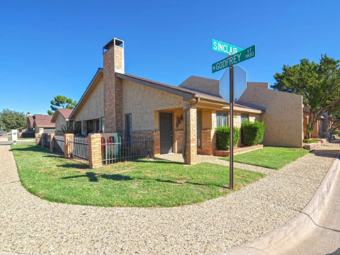 a house with a street sign in front of it