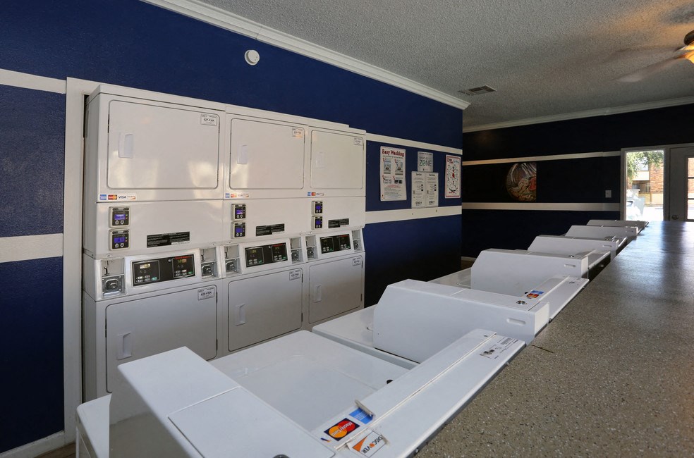 the laundry room is equipped with washers and dryers