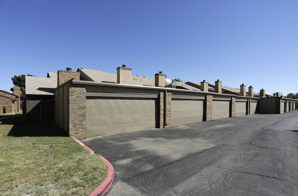 the front of a house with a driveway and a garage door