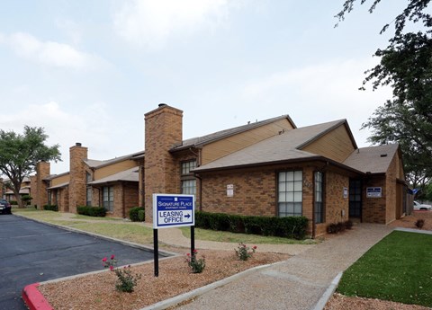 a house with a street sign in front of it