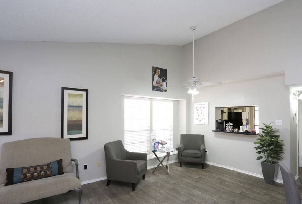 our apartments have a living room with chairs and a table