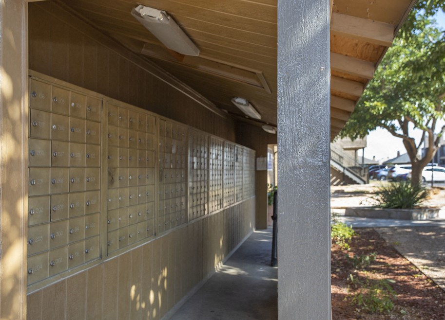 a row of mailboxes on the side of a building