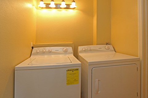 the washer and dryer in the laundry room of a home