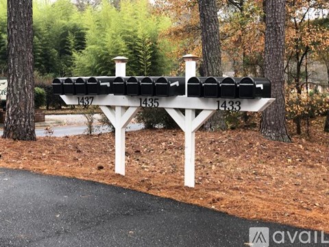 A white bench with black cushions is labeled 1437, 1435, and 1433.
