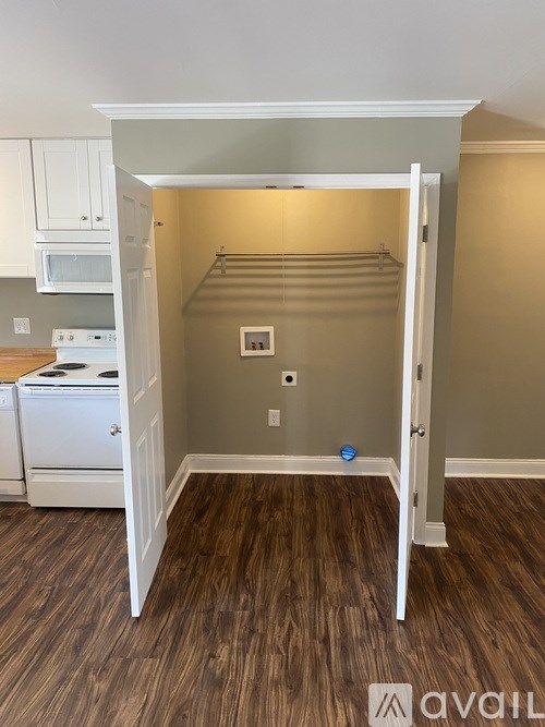 A room with a white doorway leading to a closet.