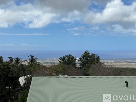A view from a building overlooking a beach and the ocean.