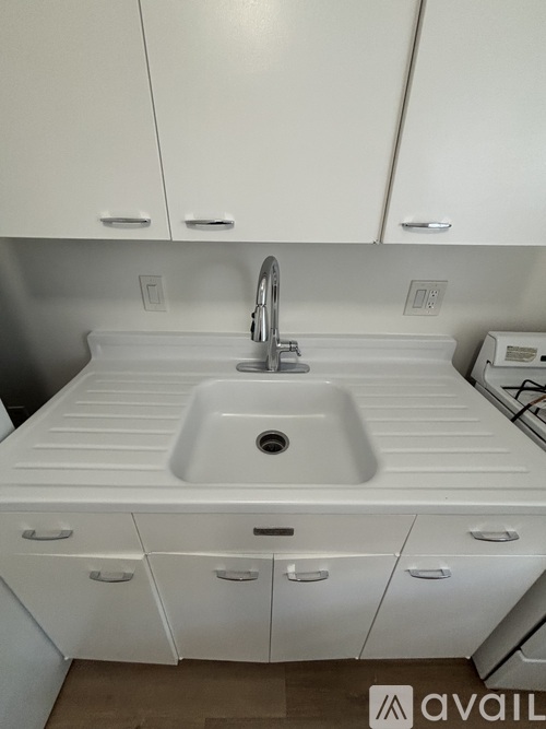A white refrigerator with its door open in a kitchen.