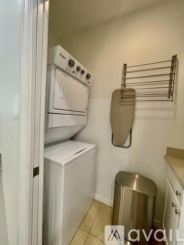 A white oven and dishwasher in a small kitchen.