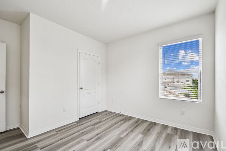 A kitchen with brown cabinets and a granite countertop.