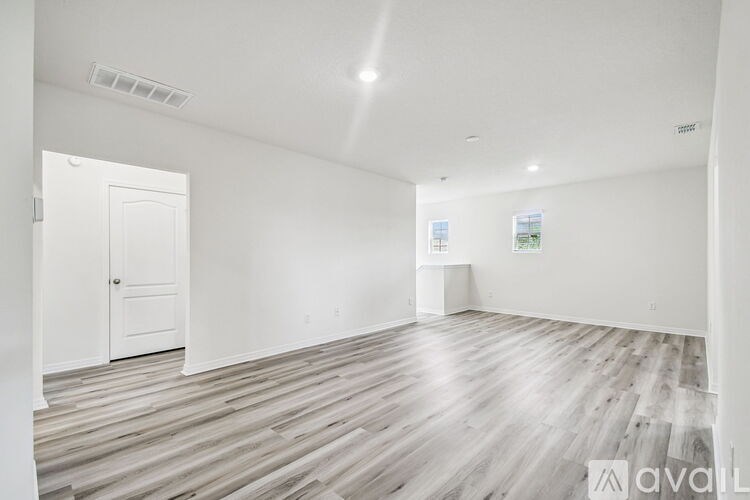 A staircase with a beige carpet and white walls.