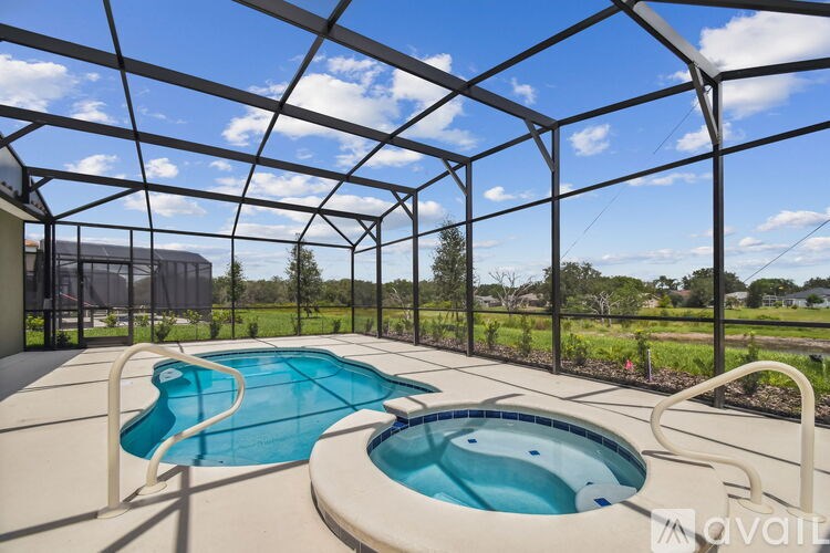 A house with a large fenced-in area in front of it.