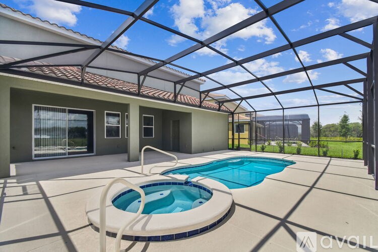 A house with a pool under a roof.